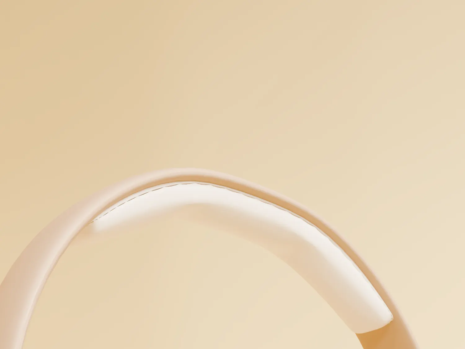 The sand-coloured headband arc against a warm cream background